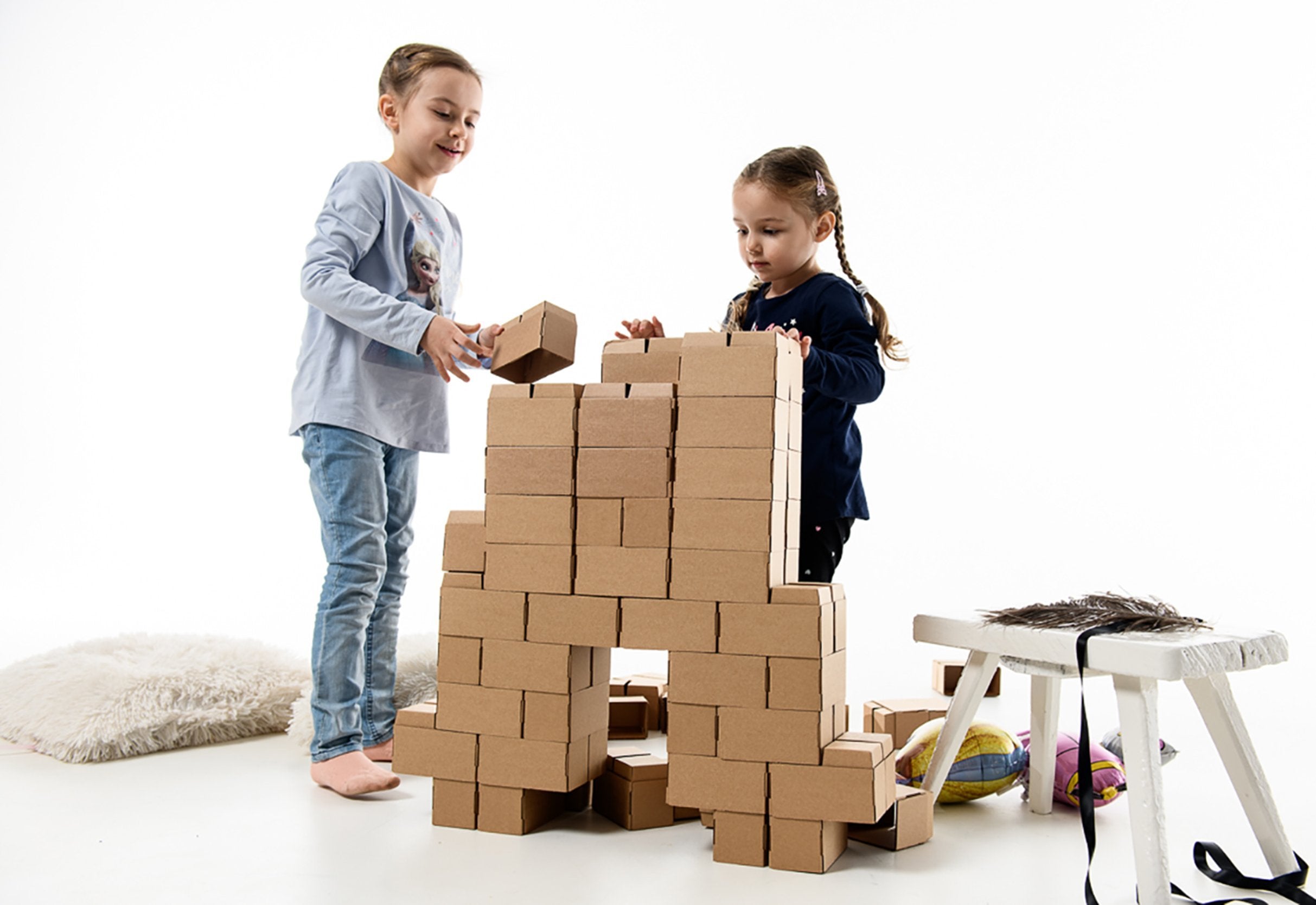 Kids building with sales blocks